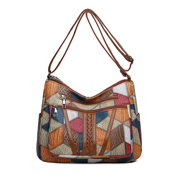 Lauranique - Borsa a tracolla in patchwork con finitura soft touch