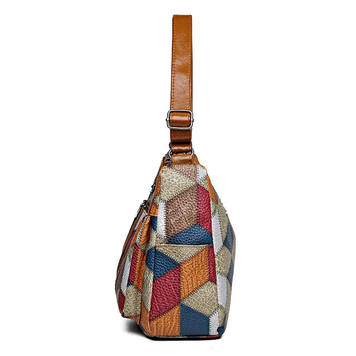 Lauranique - Borsa a tracolla in patchwork con finitura soft touch