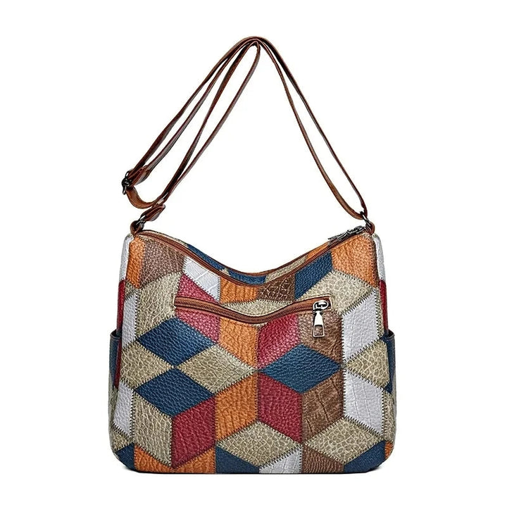 Lauranique - Borsa a tracolla in patchwork con finitura soft touch