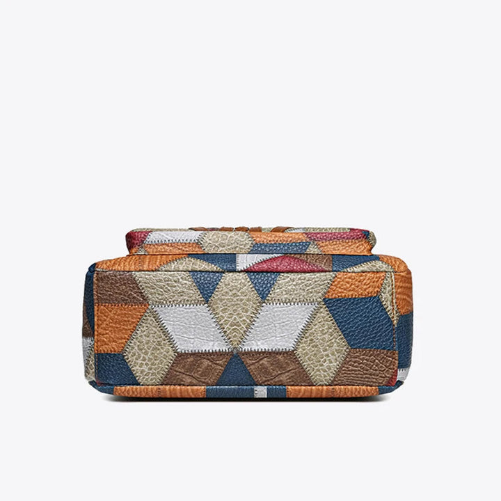 Lauranique - Borsa a tracolla in patchwork con finitura soft touch
