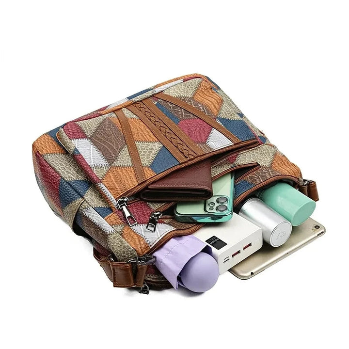 Lauranique - Borsa a tracolla in patchwork con finitura soft touch