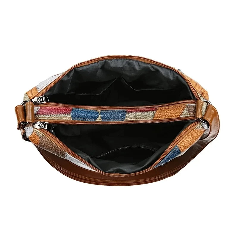 Lauranique - Borsa a tracolla in patchwork con finitura soft touch