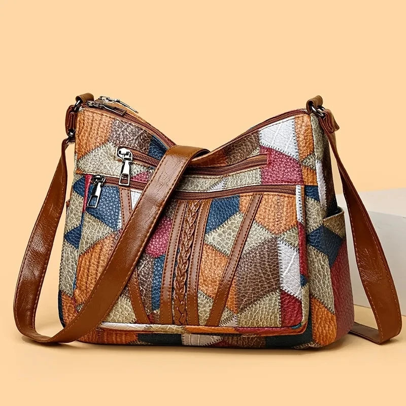 Lauranique - Borsa a tracolla in patchwork con finitura soft touch