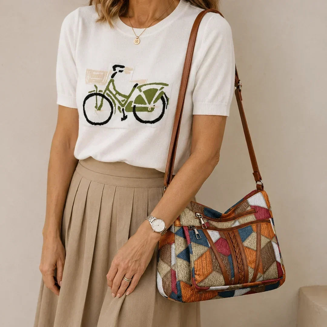 Lauranique - Borsa a tracolla in patchwork con finitura soft touch
