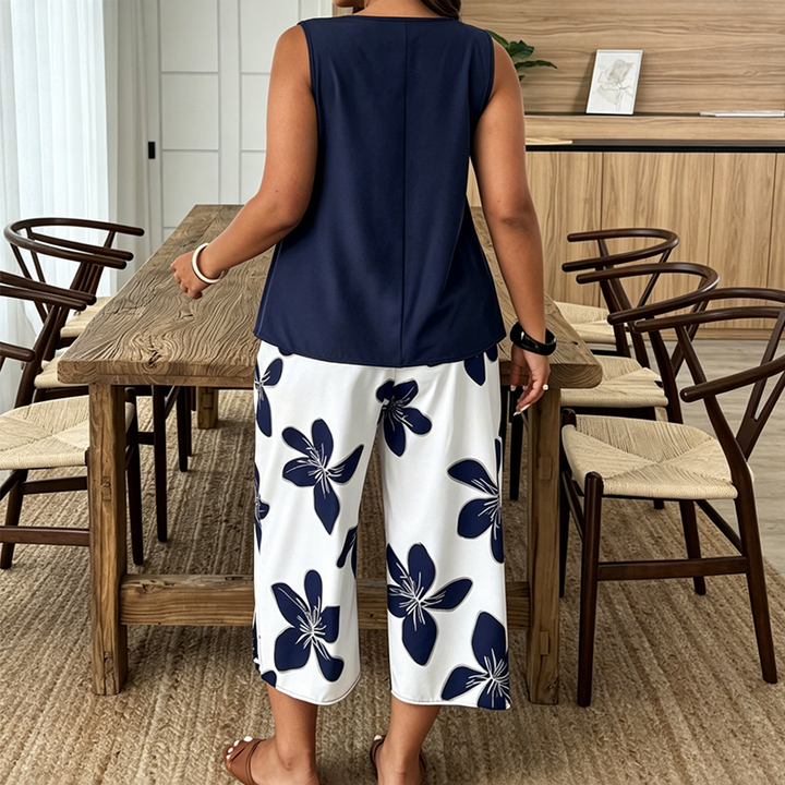 Marissa - Top asimmetrico soft touch e coordinato capri floreale