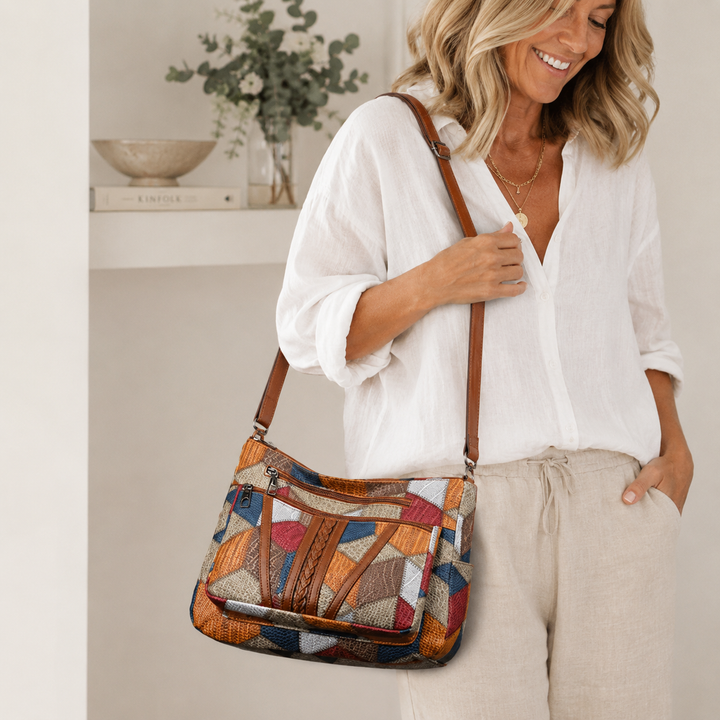 Lauranique - Borsa a tracolla in patchwork con finitura soft touch